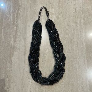 Dark iridescent braided statement necklace.